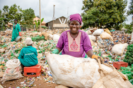 Eco Brixs team member collecting plastic waste in Uganda