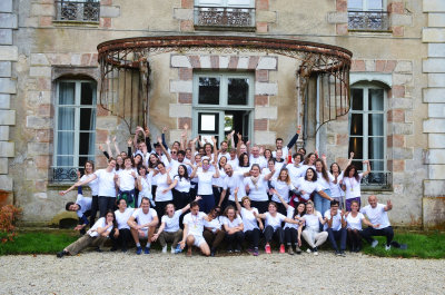 Wake Up Café team gathered in front of their building